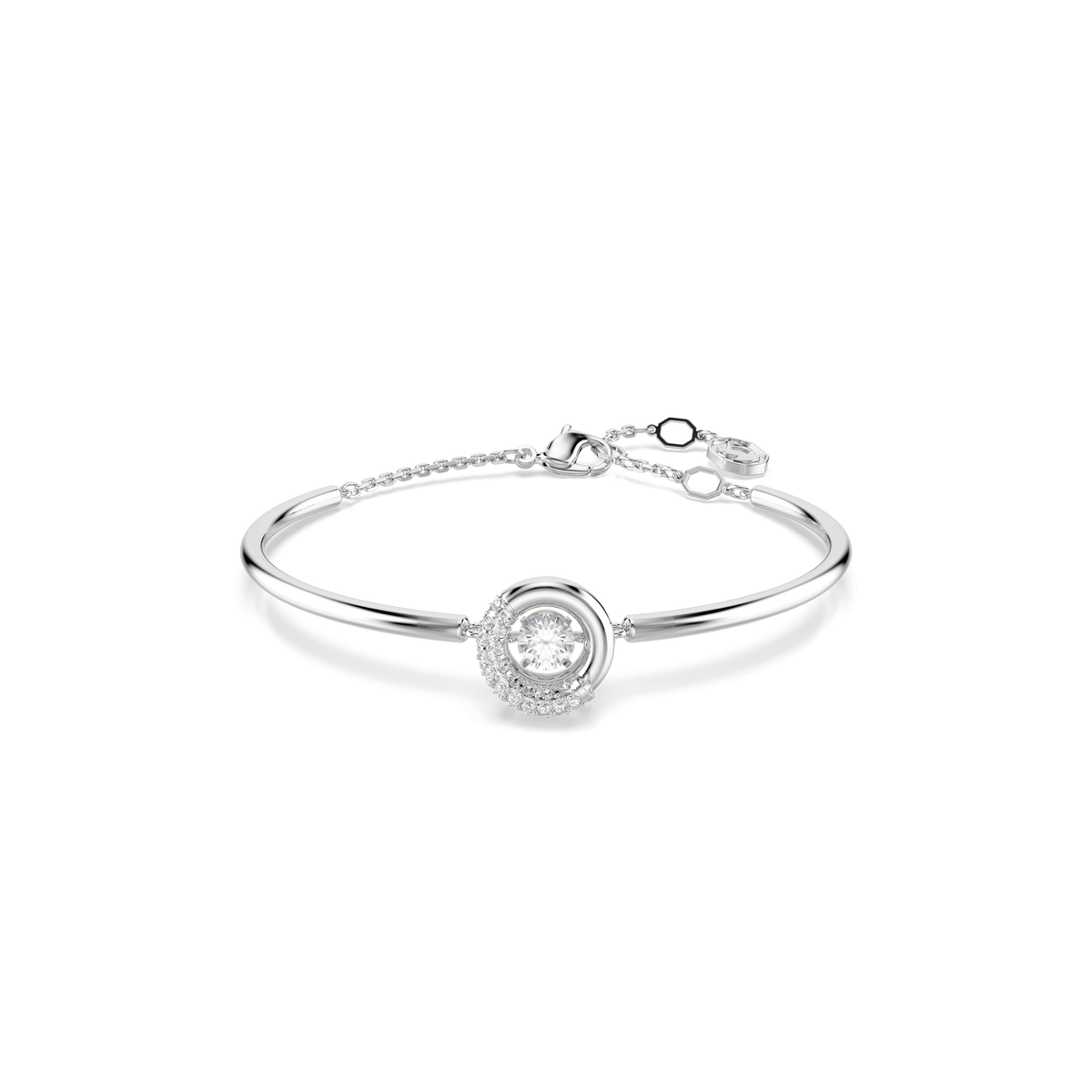 The Swarovski Dextera bangle features a round cut white stone at its center, surrounded by smaller sparkling stones and finished with a rhodium plated design; the piece is shown against a white background.