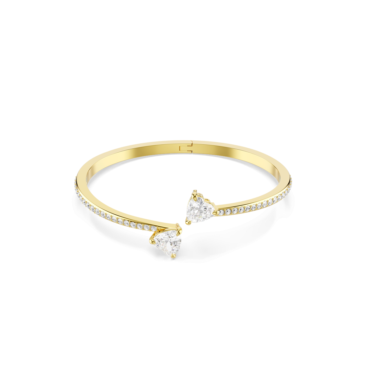 The Swarovski Mesmera bangle features two heart-shaped clear stones at each end, with small round white stones adorning half of the band, all set against a plain white background. Elegantly crafted with an 18K gold finish, this bangle from Swarovski adds a touch of sophistication to any ensemble.
