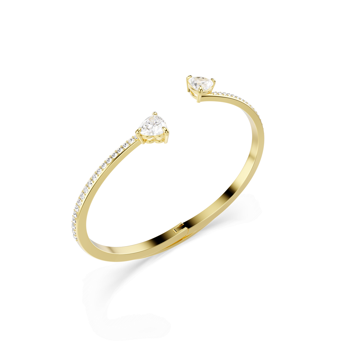 The Swarovski Mesmera bangle in an 18K gold finish showcases two heart-shaped white stones at each end and is adorned with small round stones along the band, all presented against a white background.