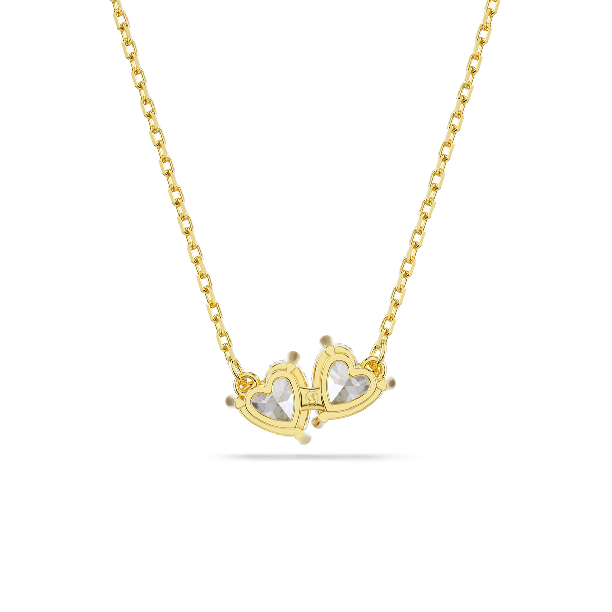 Swarovski Mesmera necklace by Swarovski, featuring two interlocking heart-shaped pendants with white Swarovski Zirconia centers and subtle 18K gold-finish accents, displayed on a white background.