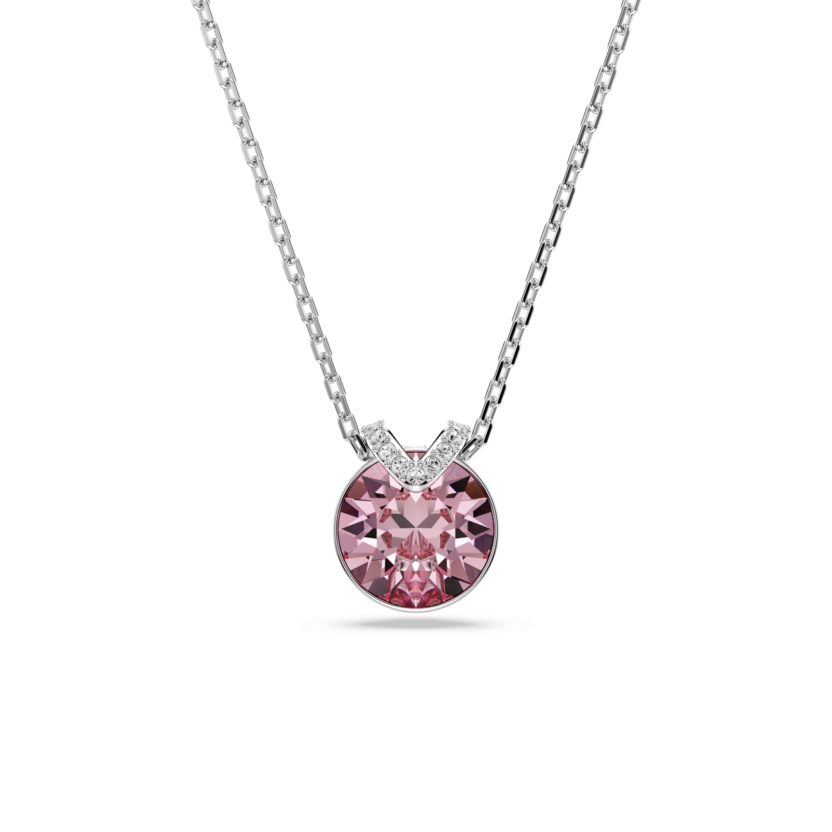The Swarovski Bella V pendant features a round-cut pink stone set in a simple prong setting, accented with small white stones above it and suspended from a fine rhodium-plated chain. Elegantly crafted, this necklace by Swarovski Canada is showcased against a white background and finished with brilliant rhodium plating for added shine.