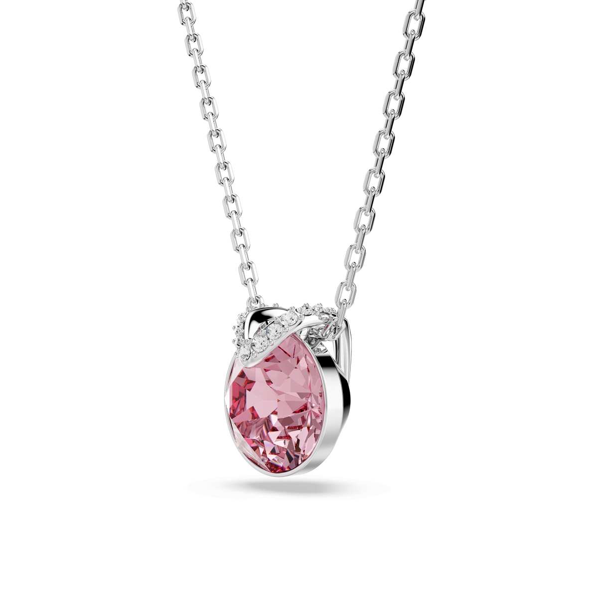 A round-cut pink Swarovski Bella V pendant, rhodium plated and accented with sparkling clear stones in a twisted silver setting, hangs elegantly from a silver chain against a plain white background—a stunning piece by Swarovski inspired by classic Canadian elegance.