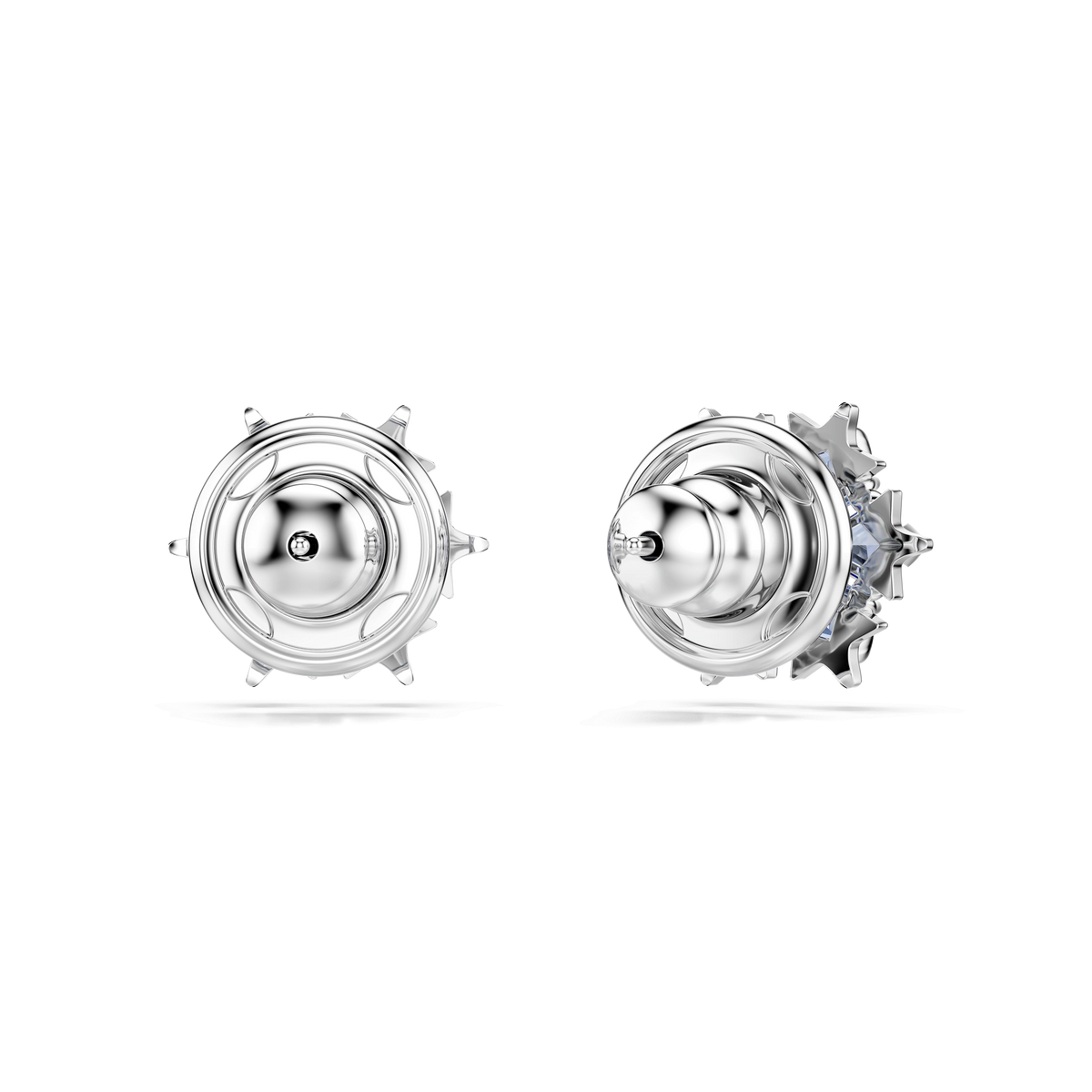 Two round, rhodium plated Swarovski Magic stud earrings featuring intricate snowflake designs with a central blue stone are displayed on a plain white background. These elegant Swarovski earrings blend sparkling detail with lasting shine.