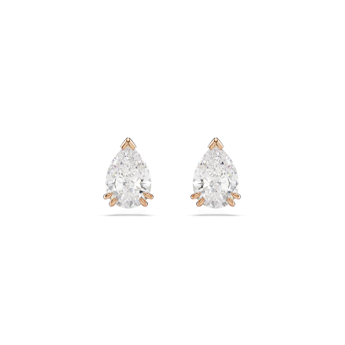 A pair of Swarovski Stilla stud earrings featuring pear-cut white gemstones in rose gold-tone plated, three-prong settings by Swarovski, displayed on a plain white background.