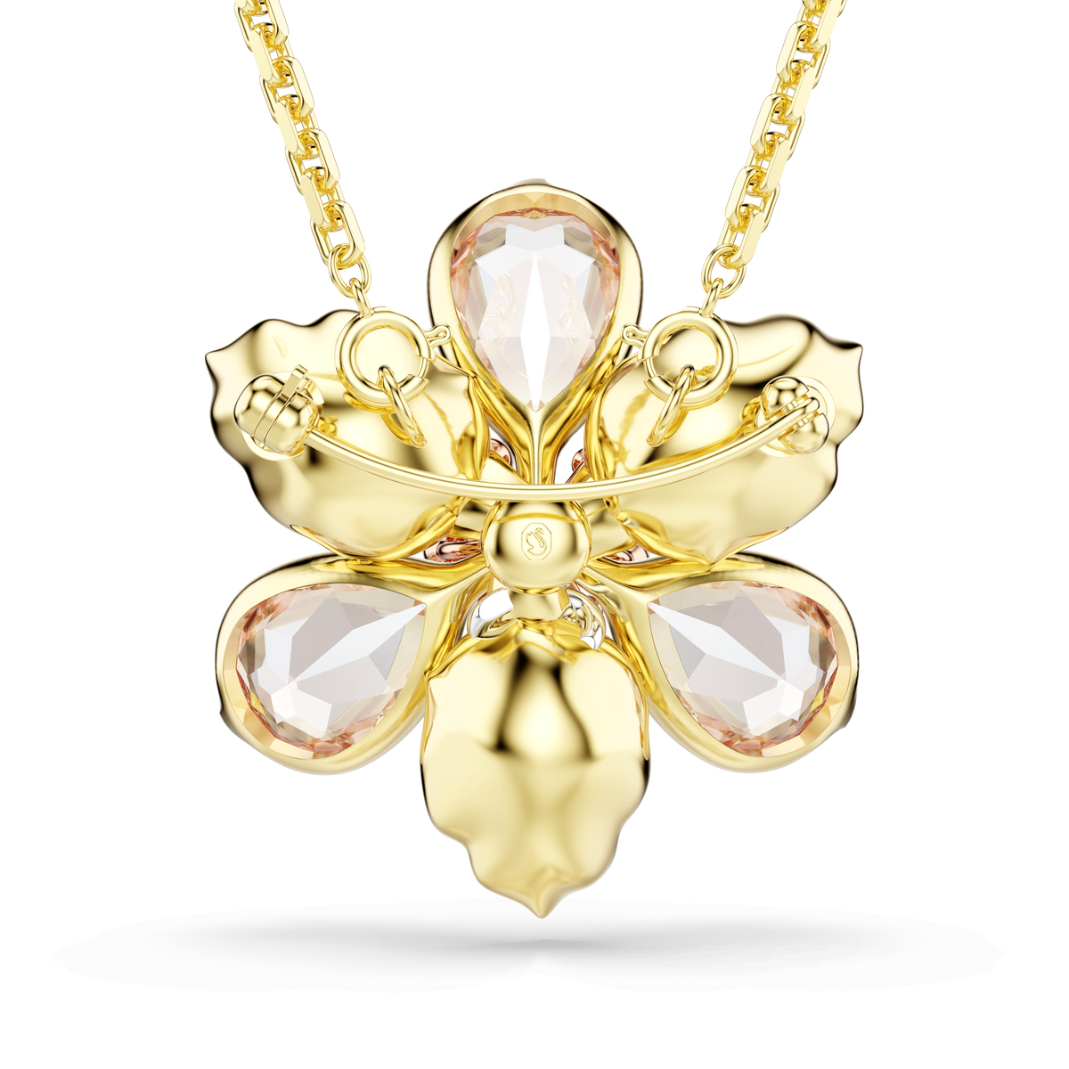 The Swarovski Idyllia Pendant Brooch MUL/GOS by Swarovski is a gold necklace featuring an orchid-shaped pendant adorned with four clear teardrop crystals as petals and a brilliant, shiny finish. This exquisite piece is available at Raffi Jewellers.