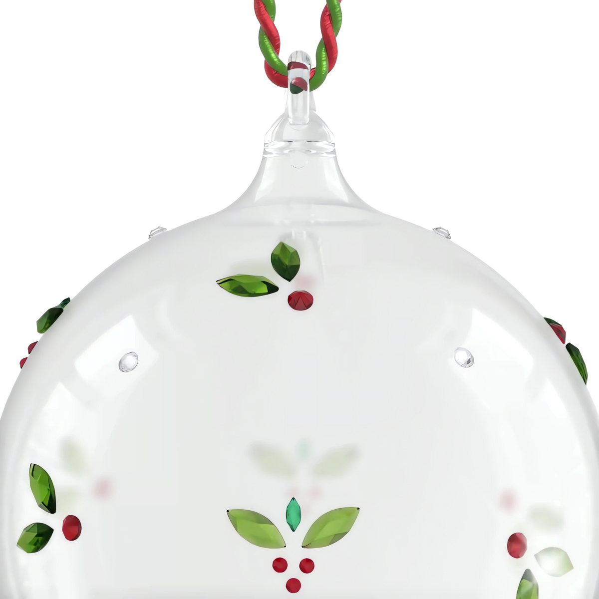 The Swarovski Holiday Cheers Mistletoe Ball Ornament by Swarovski is a clear glass ornament adorned with a nature-inspired mistletoe pattern featuring red and green leaf and berry designs, suspended by twisted red and green cords against a white background.