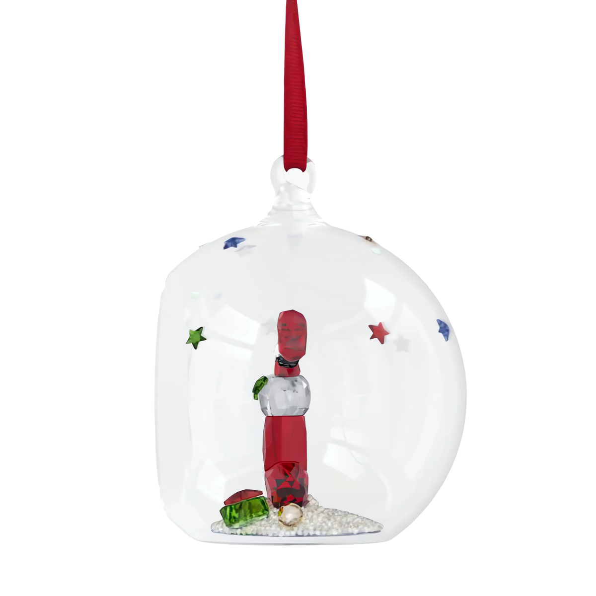 The Swarovski Holiday Cheers Stocking and Candy Ball Ornament by Swarovski is a charming glass holiday decoration, adorned with a red ribbon and featuring an intricate red and silver lighthouse inside. Surrounded by white pebbles, tiny green and red accents, and colorful stars on the surface, this enchanting ornament adds sparkle and festive cheer to your seasonal display.