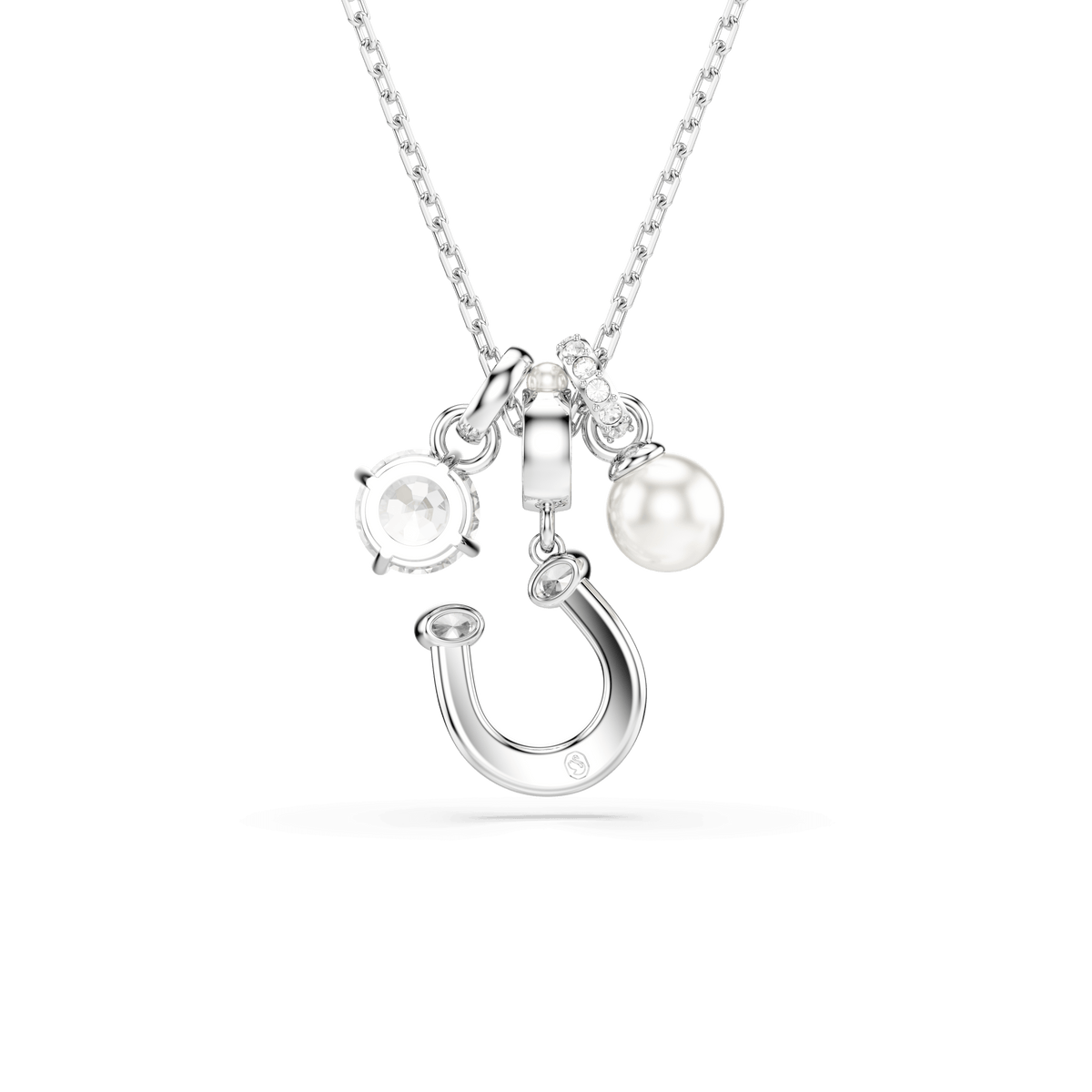 The Swarovski Symbolica pendant by Swarovski showcases three elegant charms—a pavé horseshoe, a brilliant round-cut crystal, and a luminous white Swarovski Crystal Pearl—all beautifully suspended from a rhodium-plated chain and displayed against a plain white background.