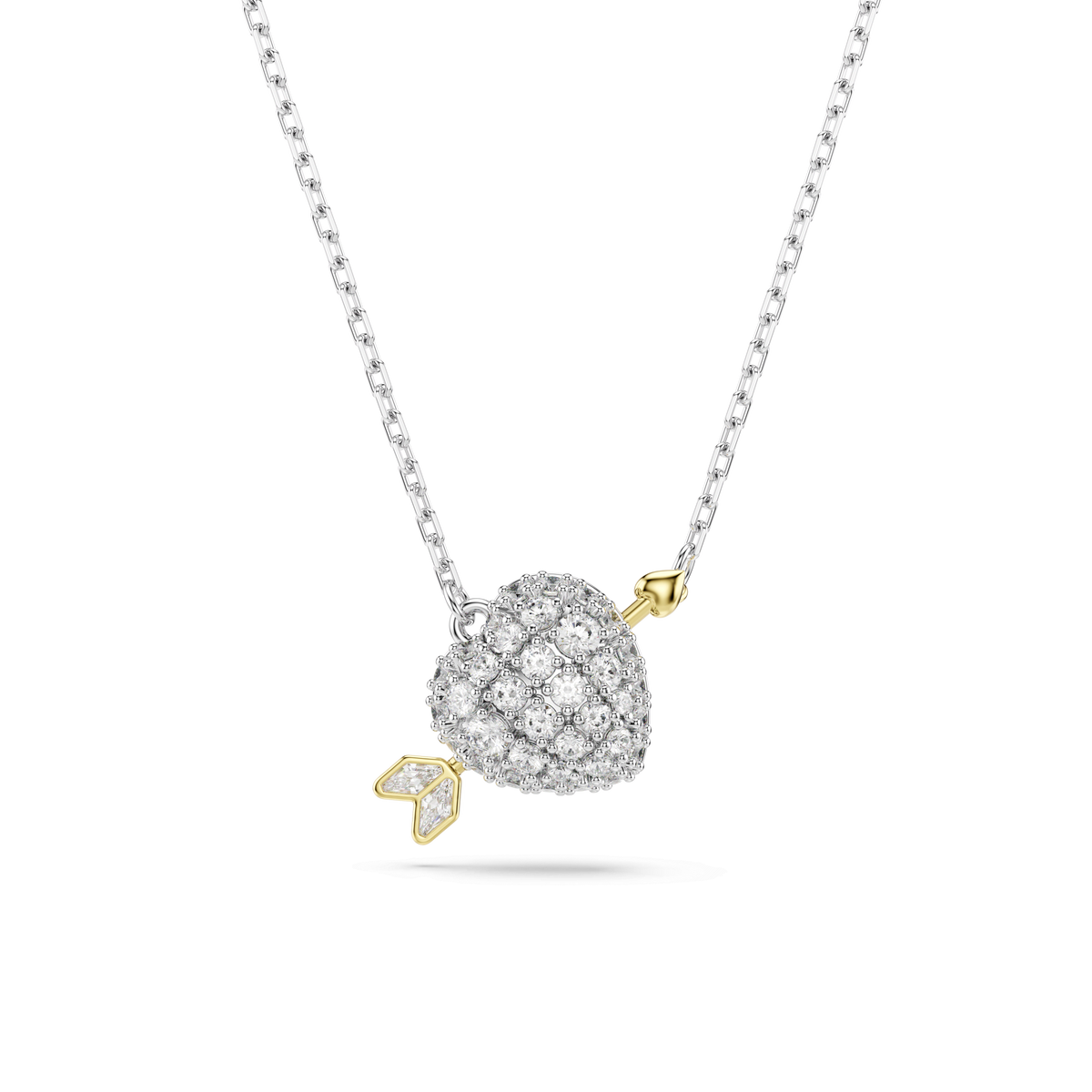 A Swarovski Idyllia pendant featuring a heart with an arrow design, adorned with mixed-cut sparkling stones and a mixed metal finish in white, set against a plain white background.