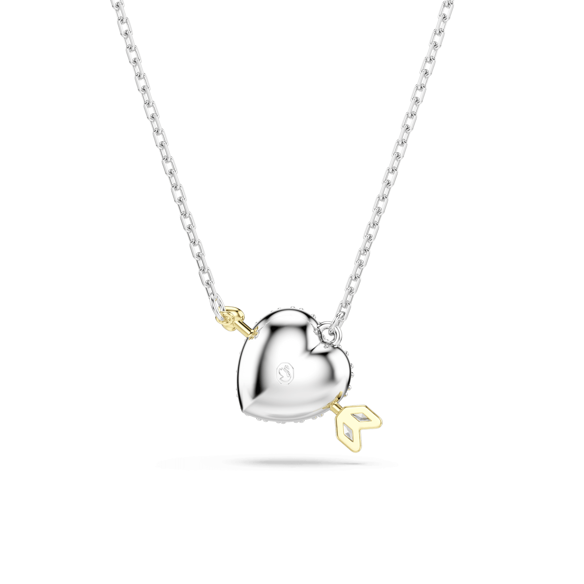 The Swarovski Idyllia pendant features a heart with an arrow design, crafted in a mixed metal finish and adorned with sparkling white Swarovski zirconia in mixed cuts. The elegant necklace rests on a delicate silver chain and is beautifully displayed against a plain white background.