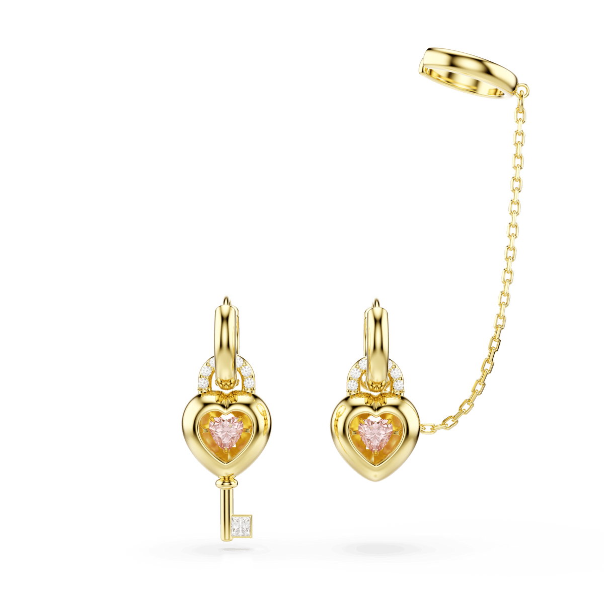 Swarovski Idyllia drop earrings with ear cuff feature mixed-cut, heart-shaped designs with key motifs in pink and are elegantly finished in 18K gold; one earring is adorned with a pink gemstone and key design, while the other matching heart earring is accented by a gold chain connecting to an ear cuff.