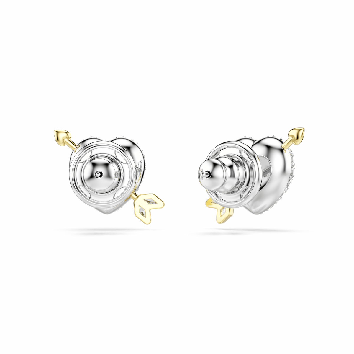A pair of Swarovski Idyllia stud earrings by Swarovski, featuring heart-shaped designs with mixed cuts, sparkling white stones, and arrow accents in a mixed metal finish—one earring showcases an arrow piercing through the heart—displayed on a plain light background.