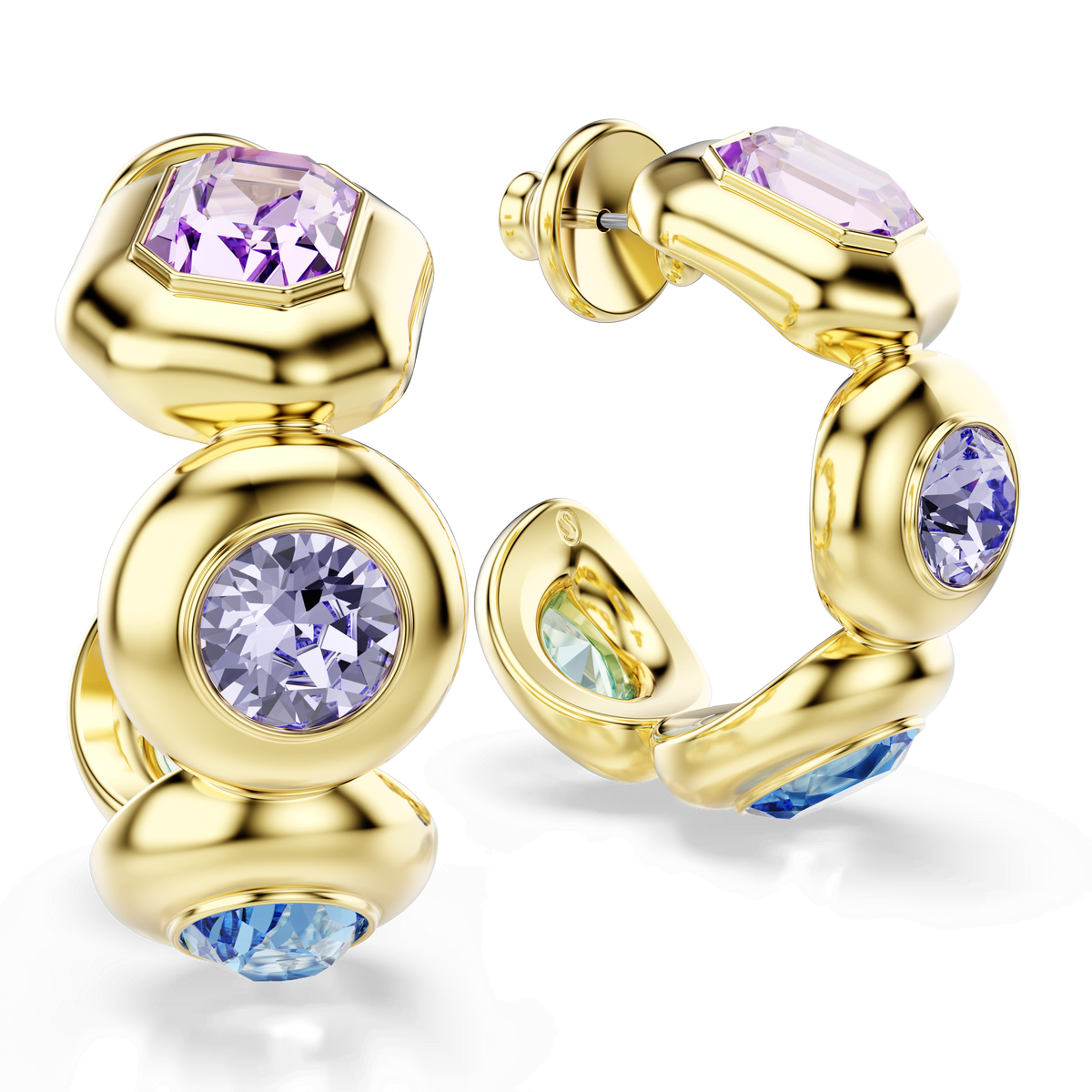 The Swarovski Gema hoop earrings by Swarovski feature mixed-cut gemstones in multicolored shades, including purple, blue, and green, set in an 18K gold finish and embellished with sparkling Swarovski crystals, beautifully displayed on a white background.