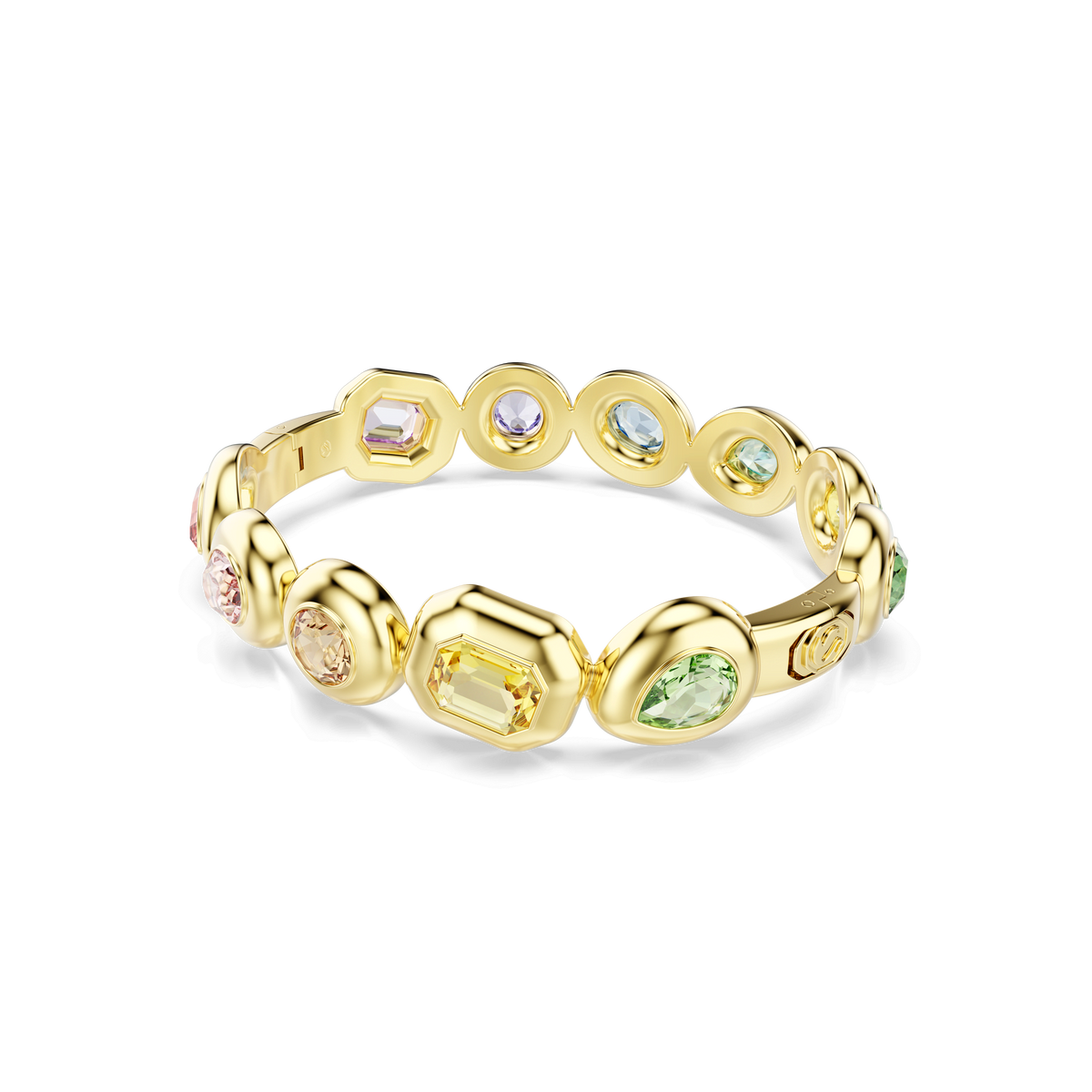The Swarovski Gema bangle, featuring an 18K gold finish, showcases bezel-set multicolored crystals in a variety of modern cuts—such as oval, emerald, and pear shapes—with asymmetrical details that add a contemporary flair. The piece is displayed against a plain white background.