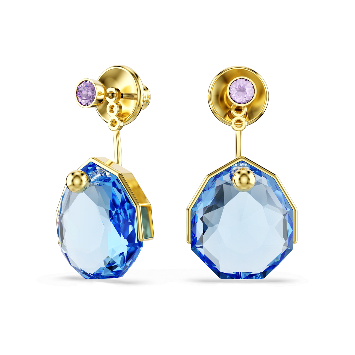 Swarovski Gema earring jackets showcase large faceted blue gemstones set in geometric designs with an 18K gold finish, each accented by a small round purple stone at the top, displayed on a white background.