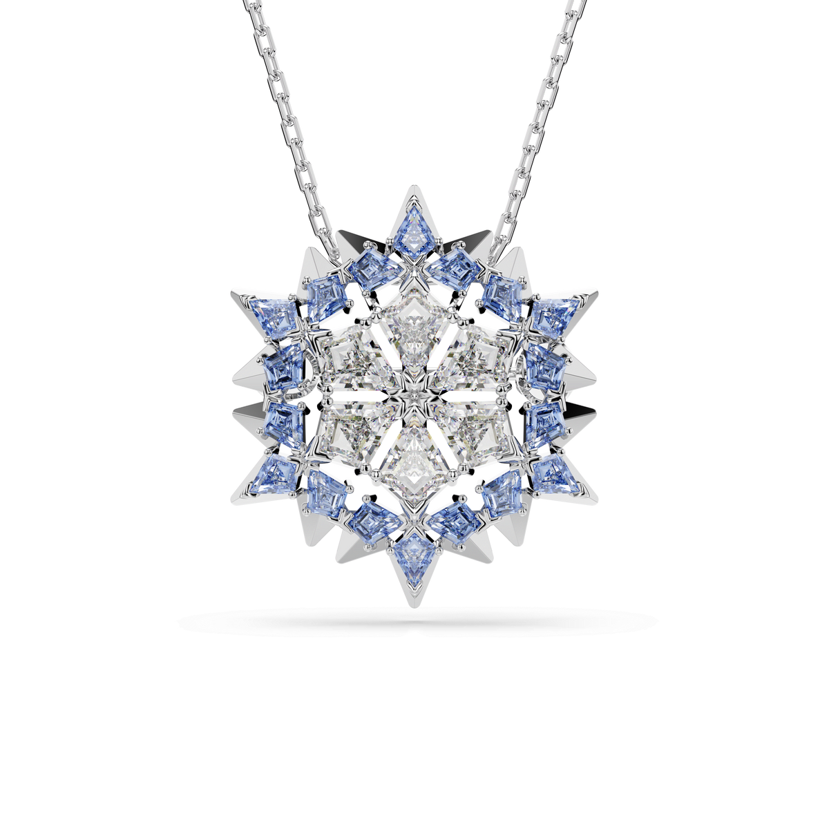 The Swarovski Magic pendant and brooch Snowflake, Blue, Rhodium plated by Swarovski is displayed on a white background, featuring an elegant star-shaped snowflake design adorned with clear and blue gemstones in a geometric pattern.