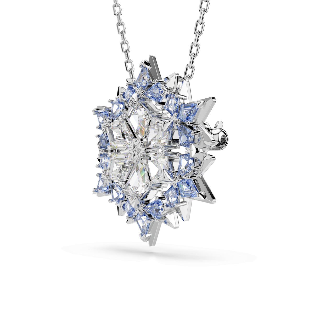 The Swarovski Magic pendant and brooch Snowflake by Swarovski is a rhodium-plated silver necklace featuring clear and light blue crystals arranged in intricate geometric snowflake patterns, displayed on a white background.