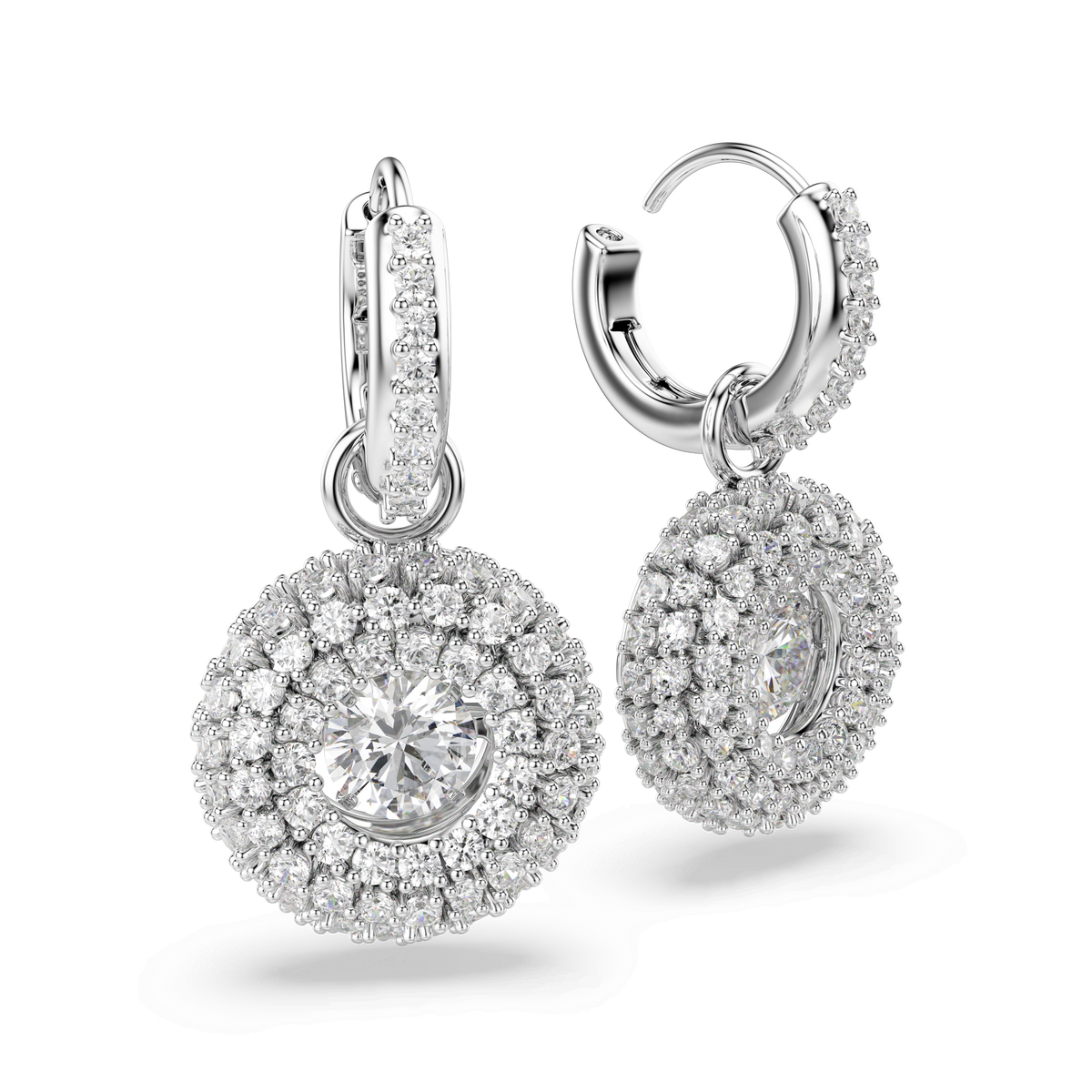 Close-up of two Swarovski Sublima drop earrings, crafted with round cut stones in a double-halo design and adorned with shimmering Swarovski crystals. Each rhodium plated earring features a prominent central white crystal, set against a plain white background—an exquisite addition to any jewelry collection from Swarovski.