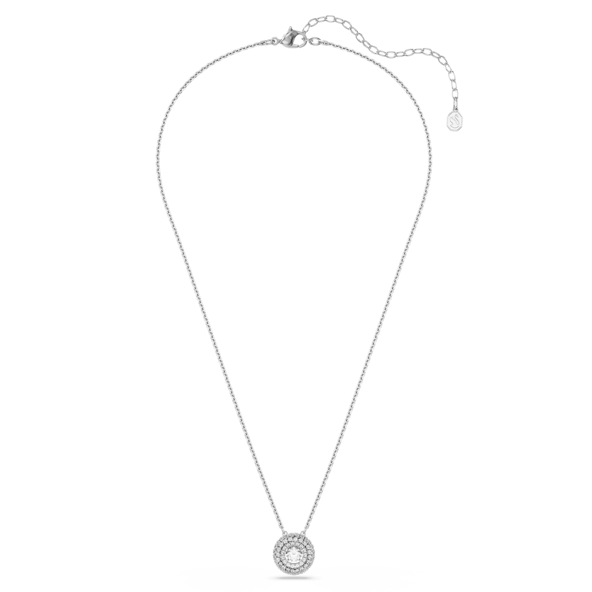 The Swarovski Sublima pendant necklace features a round-cut, white Swarovski crystal encased in a rhodium-plated setting and suspended from a silver chain with an adjustable clasp. Part of the Swarovski Sublima collection, the design is showcased on a white background and includes a small brand tag at the end of the chain.