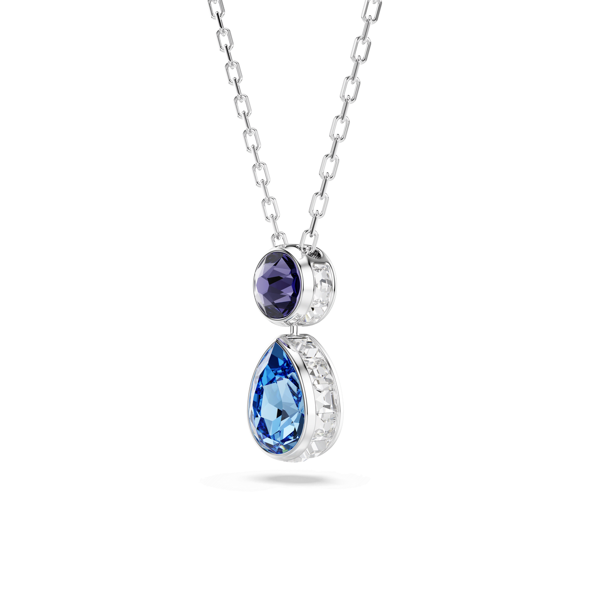 A rhodium-plated Swarovski Chroma pendant featuring mixed-cut multicolored crystals, including a round purple stone set above a larger teardrop-shaped blue gemstone, both elegantly suspended on a silver chain.