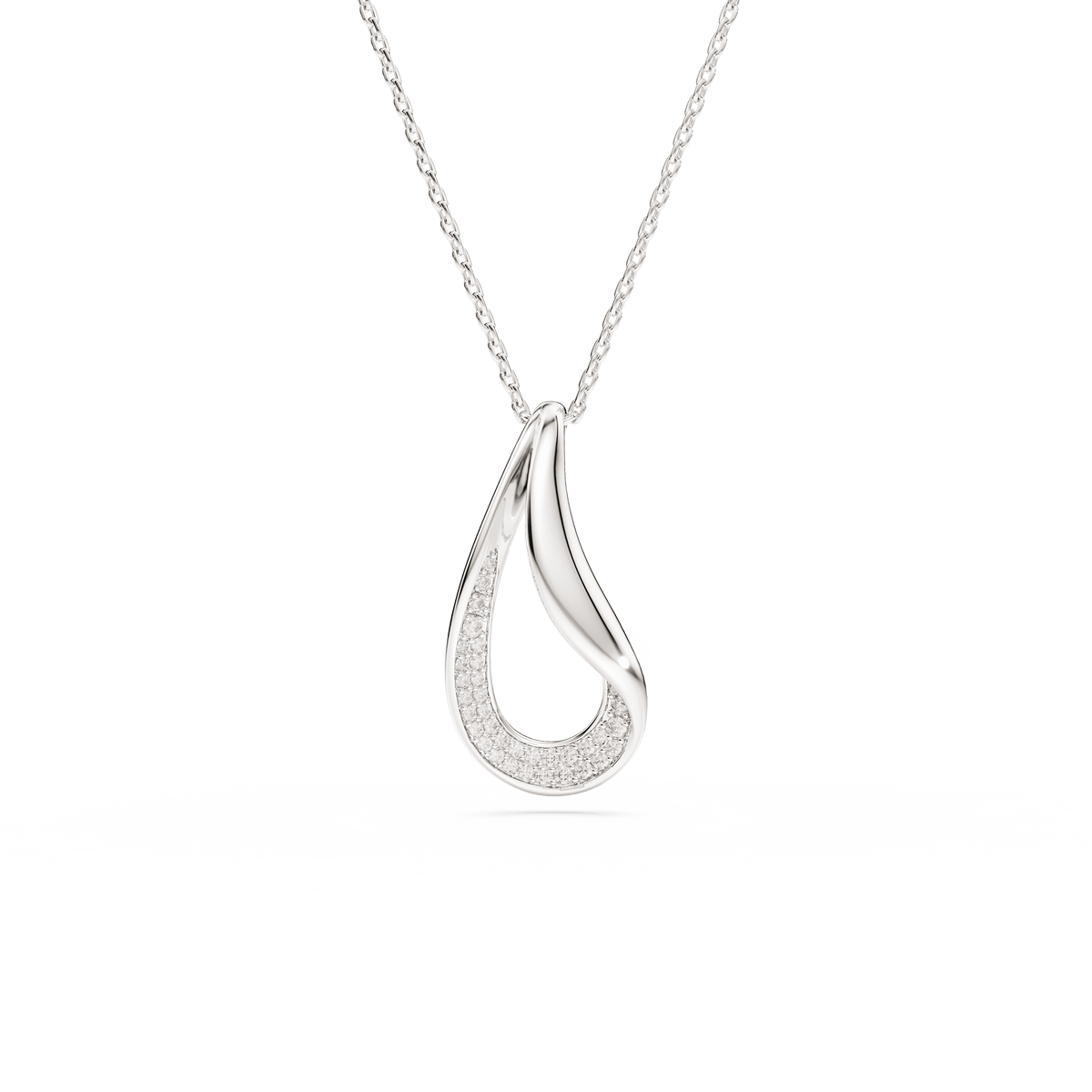 A Swarovski Classica pendant, featuring a round cut and long sterling silver design accented with white crystals, hangs from a delicate chain against a white background.