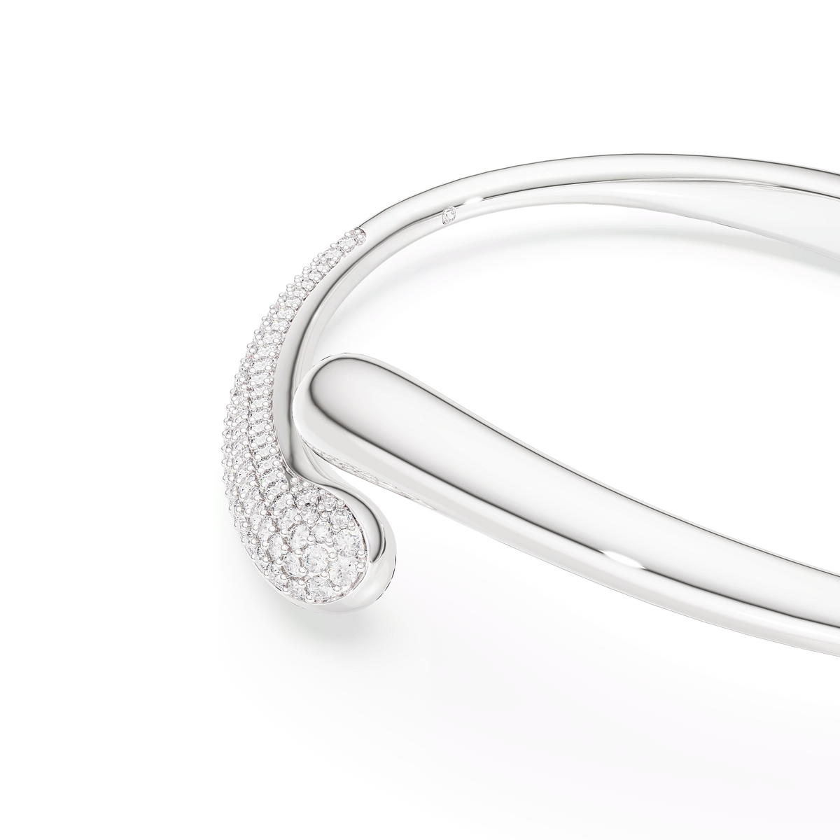 The Swarovski Classica bangle in sterling silver, crafted from recycled silver and featuring an intertwining design with dazzling round-cut white stones at one end, is displayed on a plain white background.