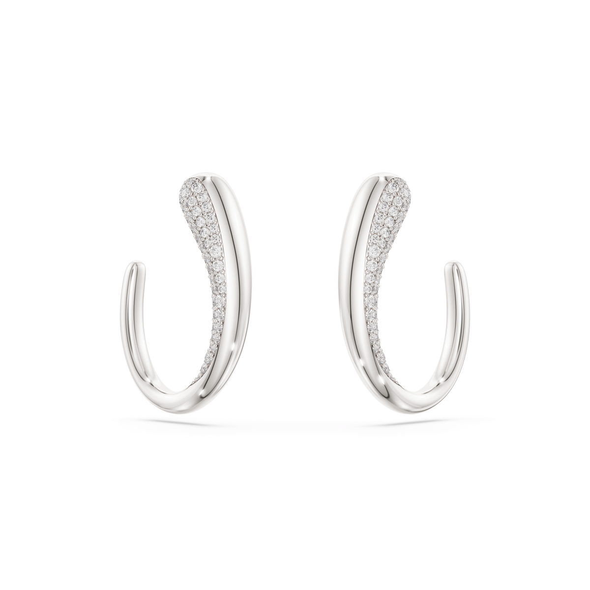 The Swarovski Classica hoop earrings feature a graceful, curved design in sterling silver, adorned with a row of sparkling round-cut white stones along the inner edge. Crafted from recycled silver by Swarovski, these earrings are showcased on a plain white background.