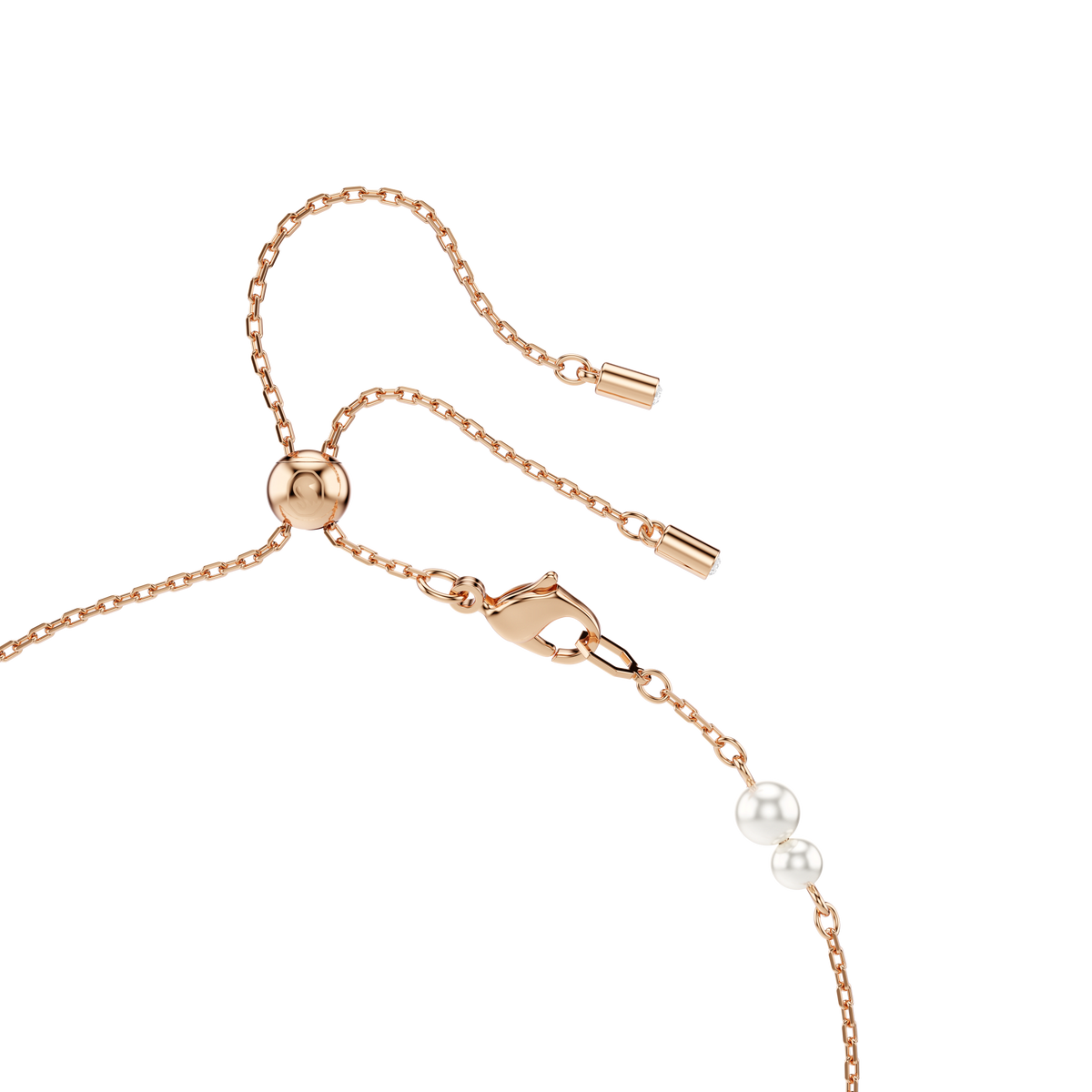 A close-up of the Swarovski Symbolica Y necklace, featuring lustrous white crystal pearls set on a delicate rose gold-tone plated chain with pavé accents and a horseshoe motif, displayed against a white background.
