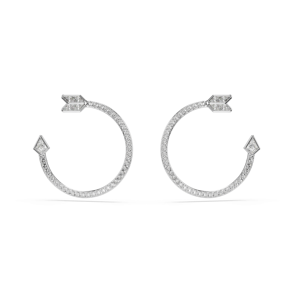 The Swarovski Idyllia hoop earrings feature a unique open circle design with arrowhead and tail details, adorned with mixed-cut sparkling stones in white and finished with a sleek rhodium plating.