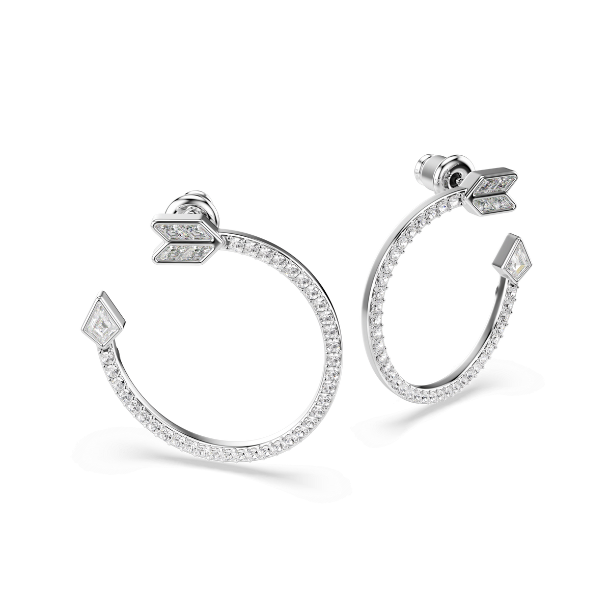 Swarovski Idyllia hoop earrings in white, featuring mixed-cut crystals with arrow-shaped ends and a rhodium-plated finish, displayed against a white background.