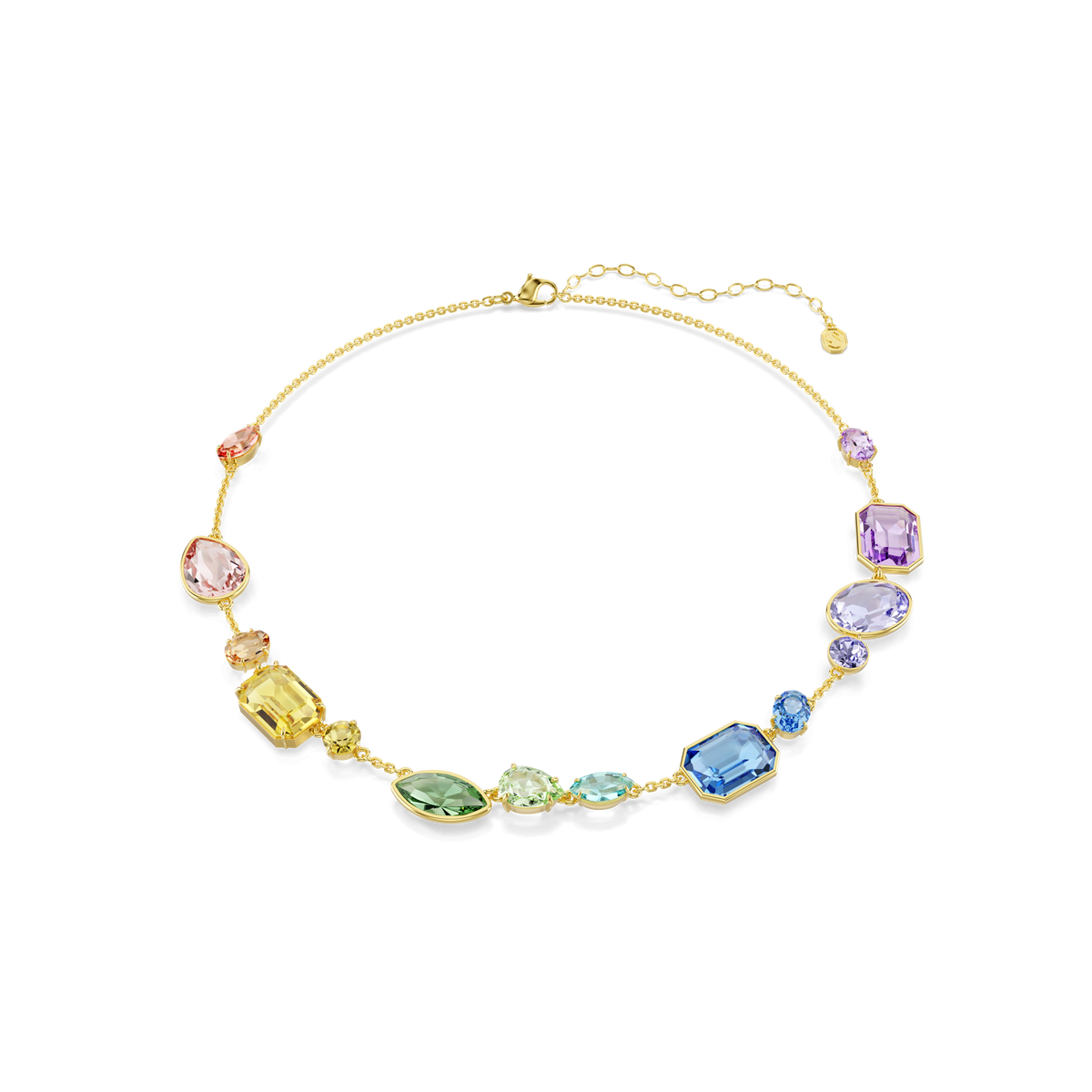 Introducing the Swarovski Gema necklace: this crew-length piece from Swarovski features an 18K gold finish and is adorned with a stunning array of multicolored, variously shaped gemstones and sparkling Swarovski crystals. Pink, yellow, green, blue, and purple stones are arranged asymmetrically along the chain, creating a vibrant yet elegant look.