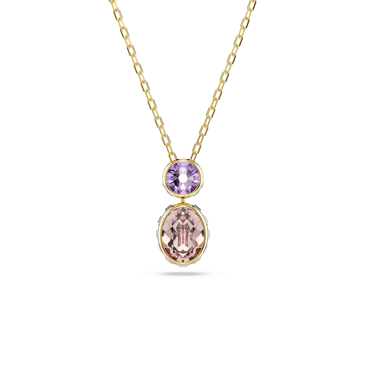 The Swarovski Chroma pendant features a stunning 18K gold finish and showcases mixed-cut, multicolored gemstones: a small round purple stone above a larger oval pink stone, both set in elegant gold bezels and beautifully displayed on a white background.