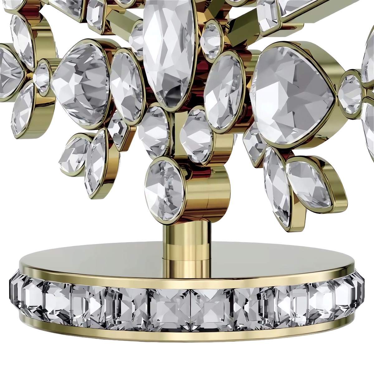 Close-up of the Swarovski Gema Holiday Tree, Crystal by Swarovski—a dazzling decorative piece featuring an array of faceted clear crystals arranged in floral motifs, set on a round gold base embellished with square-cut stones—an elegant choice for holiday décor or as a shimmering tree ornament.