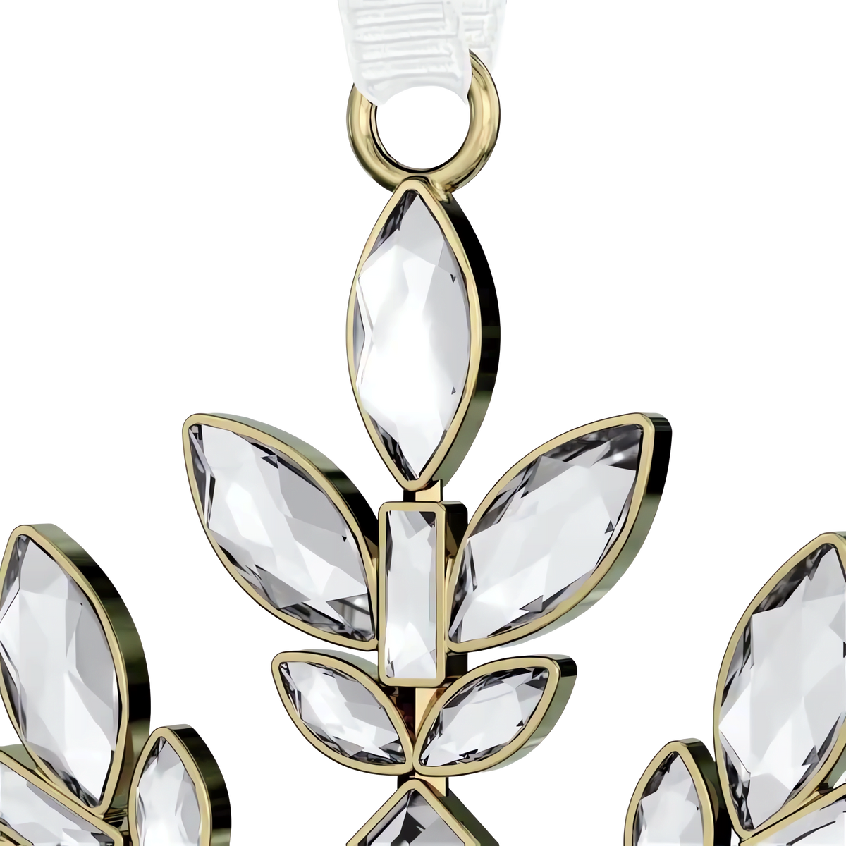A close-up of the Swarovski Gema Holiday Ornament, Crystal—a shimmering creation by Swarovski—showcasing a gold-framed, clear gemstone pendant shaped like an abstract leaf or petal cluster reminiscent of a delicate snowflake. Multiple marquise and rectangular crystals are set in a symmetrical design against a white background.
