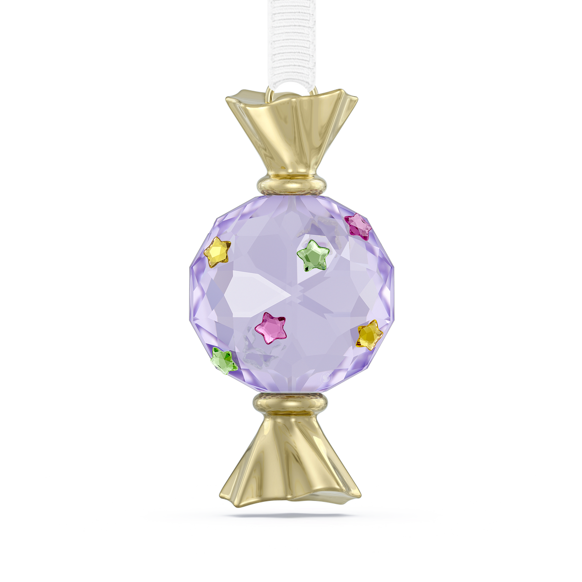 A faceted, light purple candy-shaped ornament with gold ends, adorned with small star-shaped gems in pink, yellow, and green, and suspended from a white ribbon—this charming Swarovski Holiday Cheers Dulcis Candy Ornament in Violet is the perfect touch for your festive holiday décor.