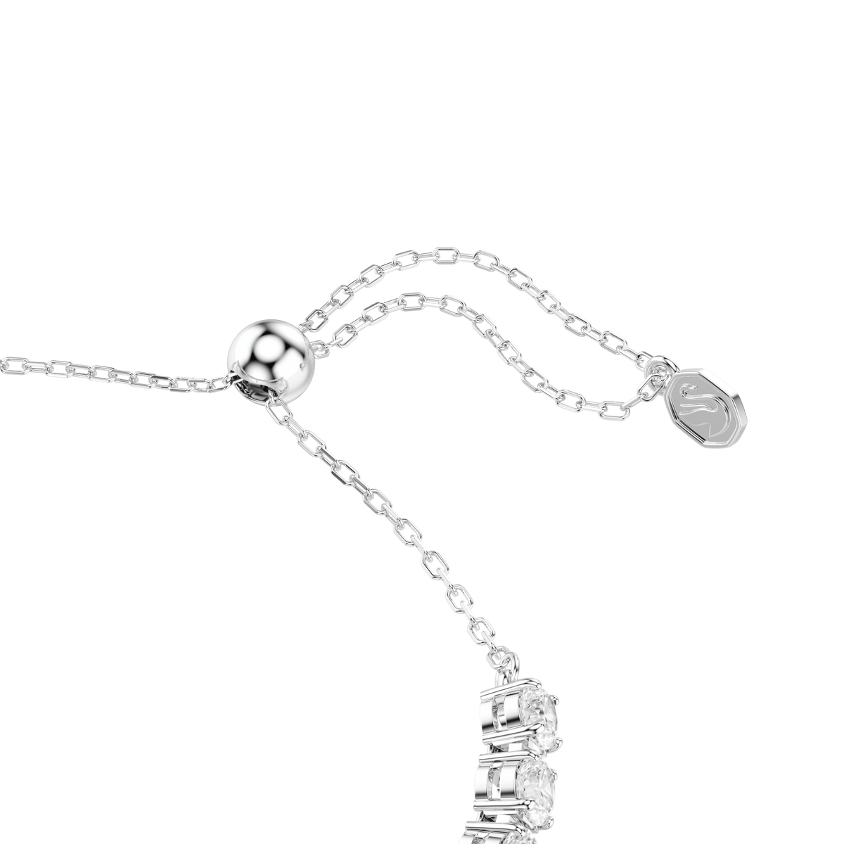 A close-up of the Swarovski Ariana Grande x Swarovski bracelet showcases its rhodium-plated, delicate chain with a sliding clasp and a small oval tag engraved with the Swarovski logo. The bracelet features mixed-cut, multicolored Swarovski Zirconia stones that add sparkling detail.