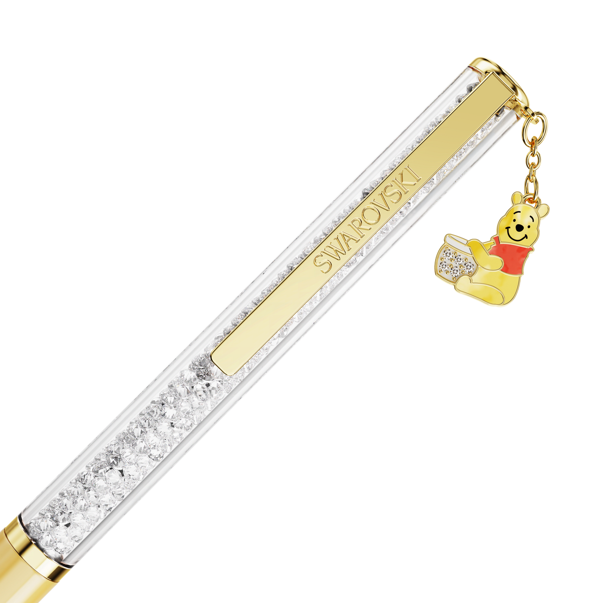 The Swarovski Crystalline ballpoint pen, Yellow lacquered and Gold-tone plated, features an adorable Winnie the Pooh charm in his signature red shirt holding a honey pot—this Disney-inspired accessory sparkles with Swarovski crystals and timeless charm.