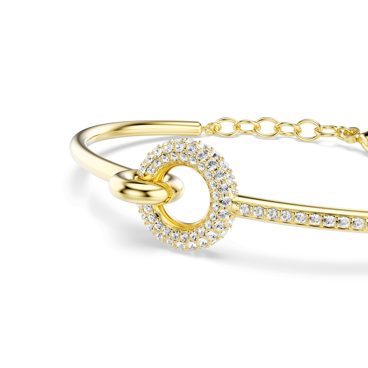 The Swarovski Dextera bangle showcases a round-cut centerpiece adorned with sparkling white crystals and an adjustable chain clasp, all exquisitely crafted with an 18K gold finish.