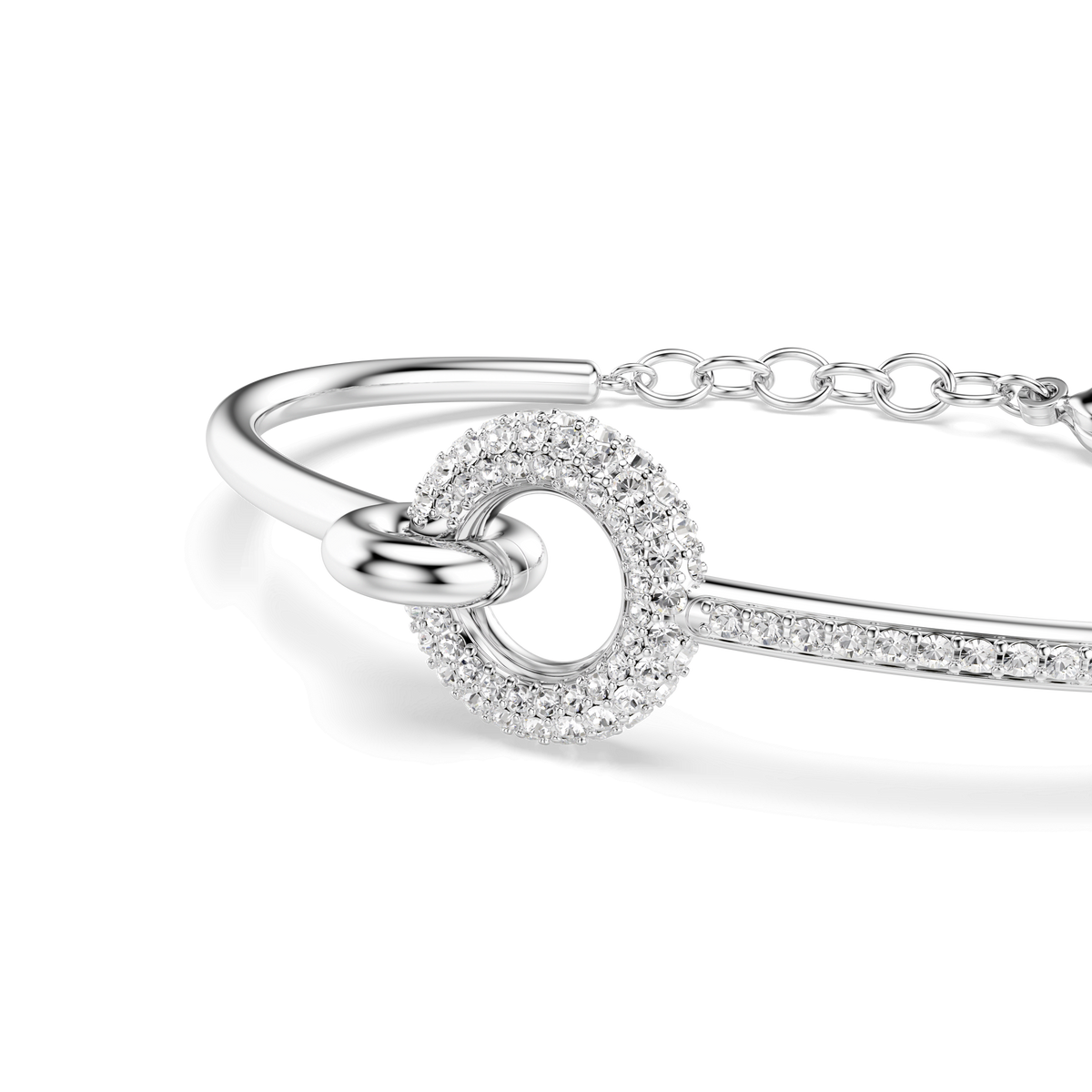 Swarovski Dextera bangle—featuring a round cut, crystal-adorned centerpiece and a sleek linked chain clasp, rhodium plated for added brilliance by Swarovski—displayed on a plain white background.