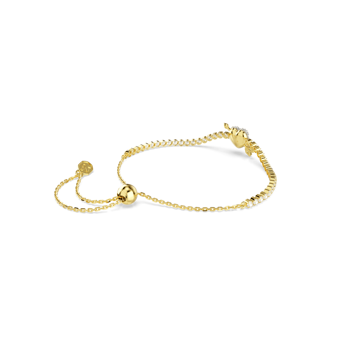 An elegant Swarovski Idyllia bracelet featuring mixed-cut stones and a heart with arrow motif in white, set on an adjustable 18K gold finish chain with a small round slider clasp, is displayed against a plain white background.