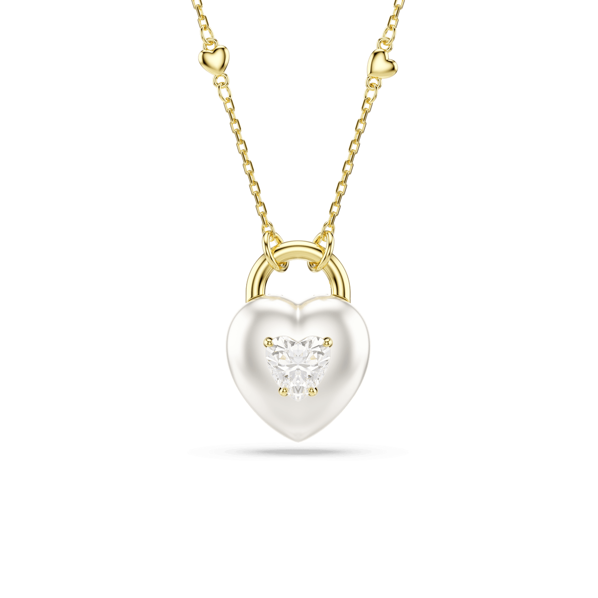 The Swarovski Idyllia pendant necklace showcases a heart-shaped design with mixed cuts in white, finished with 18K gold accents and delicate heart details along the chain, set against a white background.