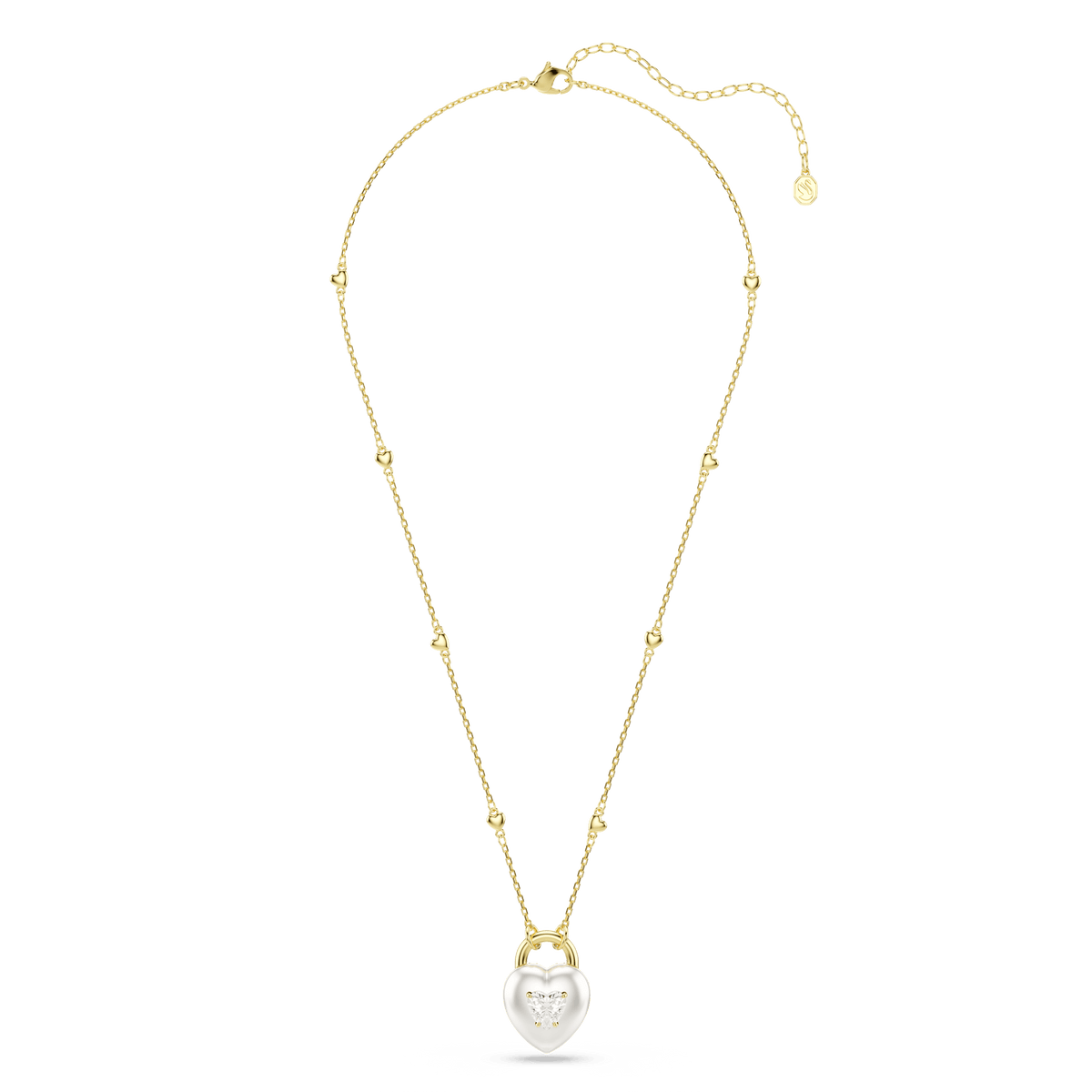 Introducing the Swarovski Idyllia pendant: a heart-shaped necklace with mixed-cut stones, featuring a delicate engraved design on the front. This elegant accessory showcases Swarovski’s signature craftsmanship with an 18K gold finish and an adjustable clasp for a perfect fit. The necklace is photographed against a plain white background.
