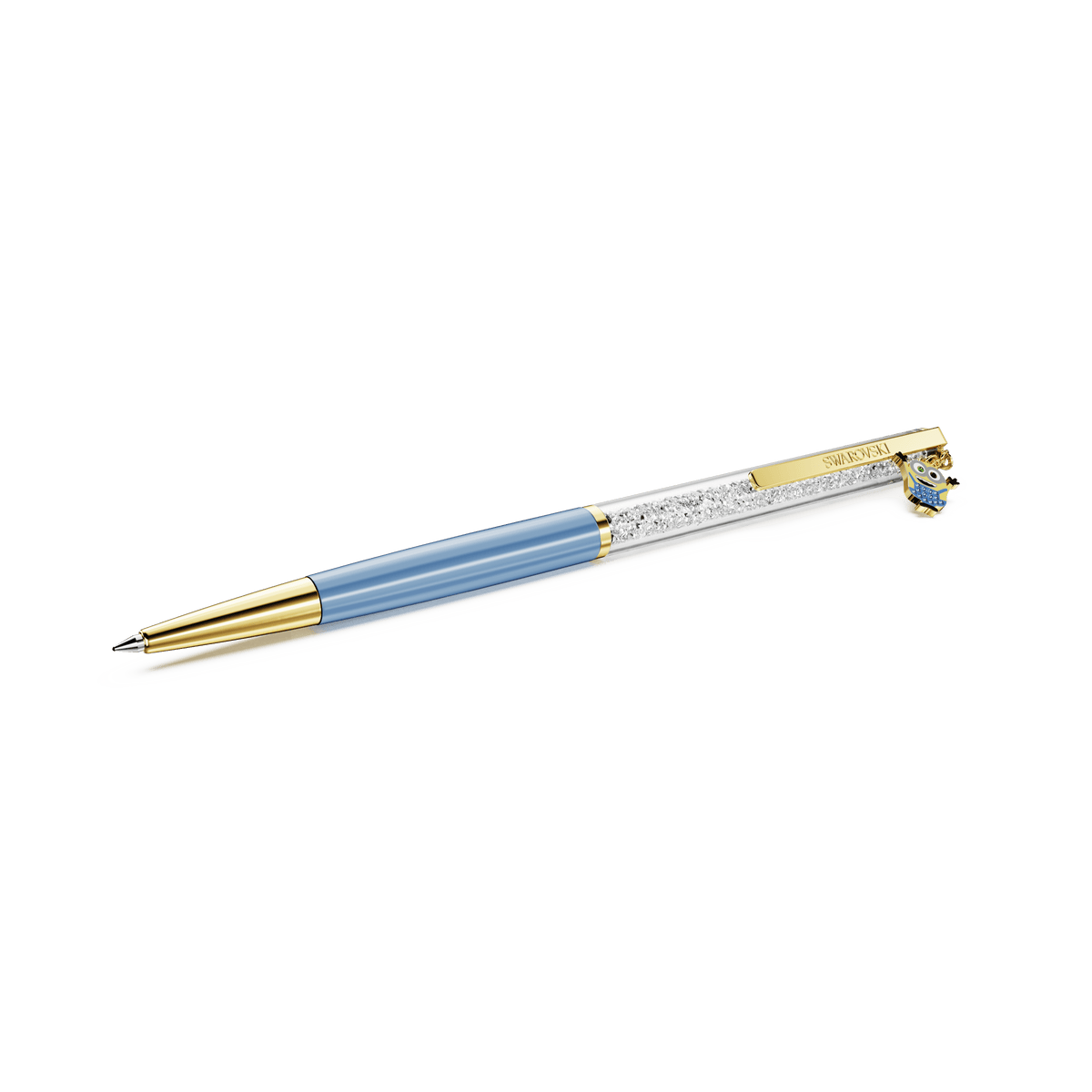 A Swarovski Crystalline ballpoint pen featuring sparkling blue and gold-tone plating, adorned with Minions detailing and a playful owl charm on the clip, is set against a white background.