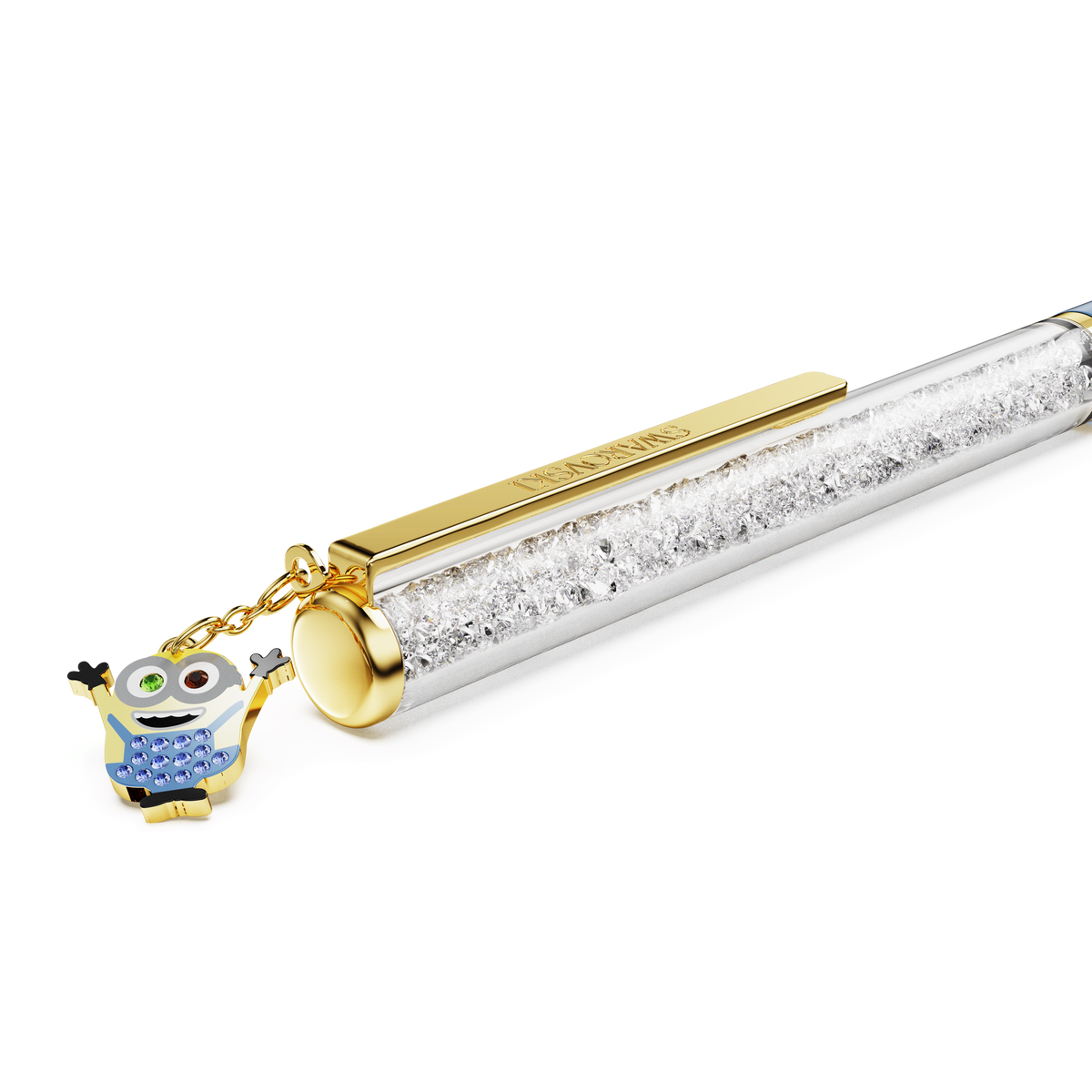 A Swarovski Crystalline ballpoint pen, Minions edition, in blue with gold-tone plating and filled with sparkling crystals, featuring a hanging Minions Bob pen charm, shown on a white background.