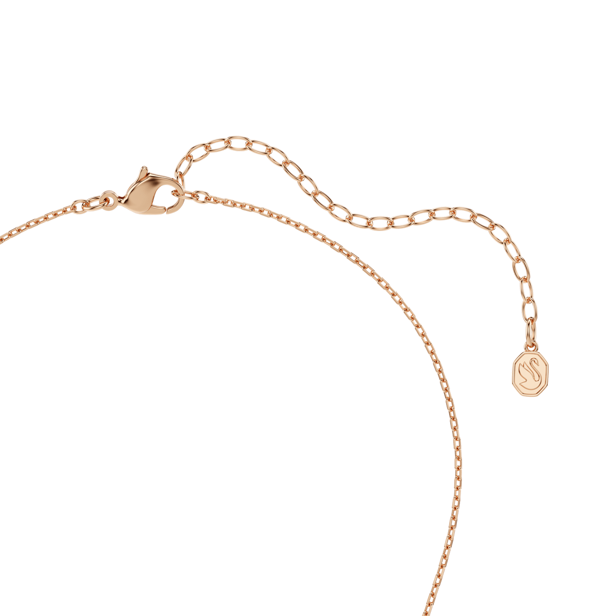 Close-up of the Swarovski Idyllia necklace, featuring an 18K rose gold finish with mixed cut detailing, a delicate heart with arrow pendant, and an adjustable chain completed with a round charm engraved with a wavy design.