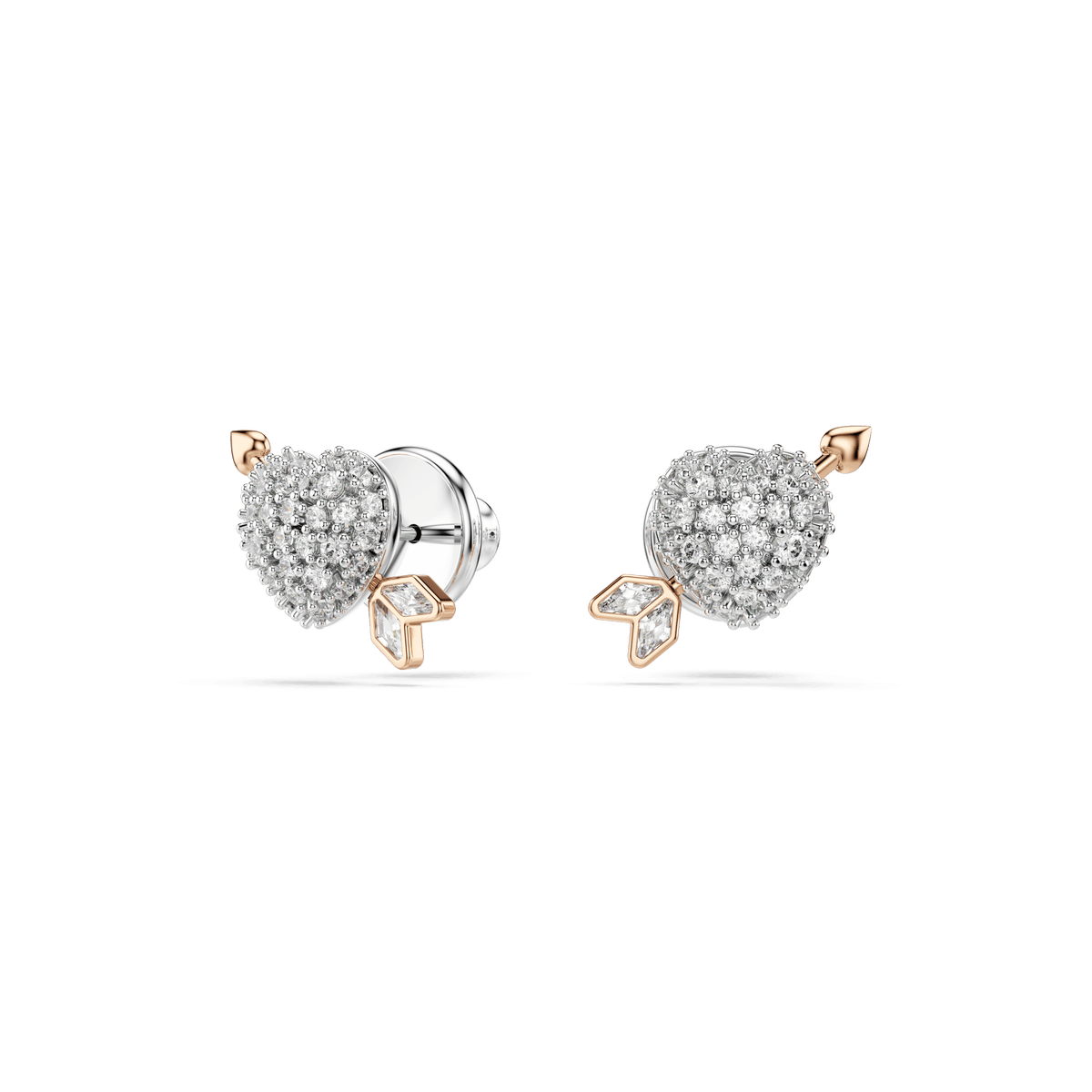 The Swarovski Idyllia set features heart-shaped stud earrings adorned with mixed-cut stones and elegant arrow details in 18K rose gold finish, presented against a clean white background.