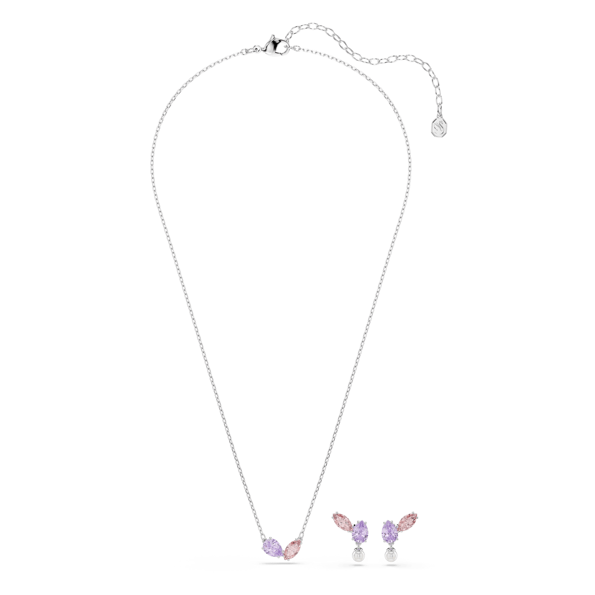 The Swarovski Ariana Grande x Swarovski set, featuring rhodium plated jewelry with mixed-cut pink and purple gemstones arranged in a symmetrical floral design and embellished with sparkling Swarovski Zirconia, is displayed on a plain white background.