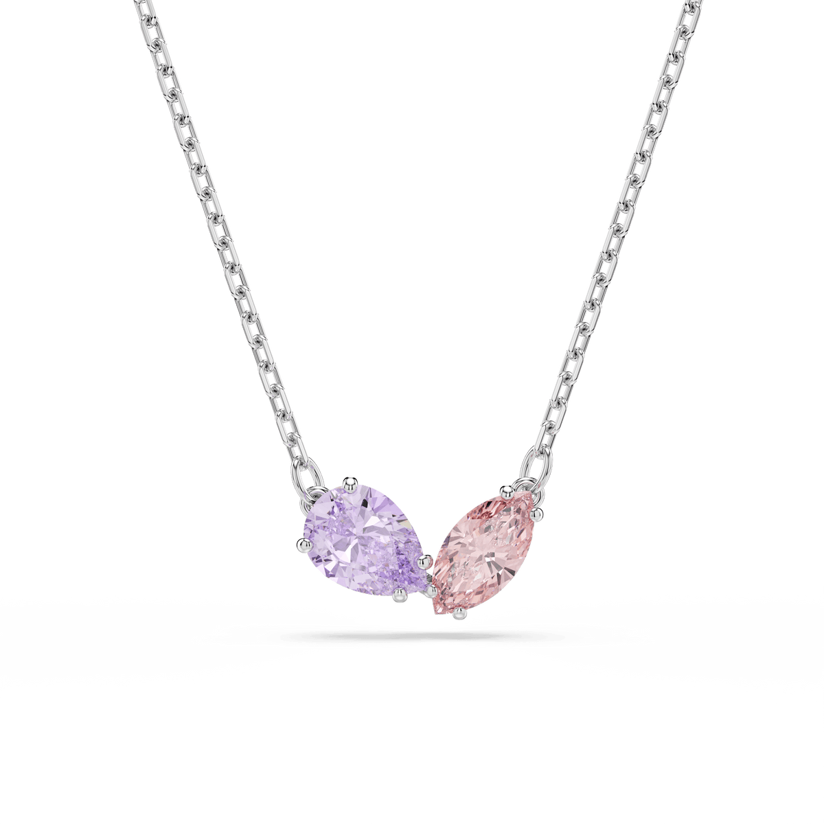 The Swarovski Ariana Grande x Swarovski set is a rhodium-plated necklace featuring two pear-shaped, multicolored Swarovski Zirconia gemstones—one in light purple and one in light pink—arranged side by side as pendants.