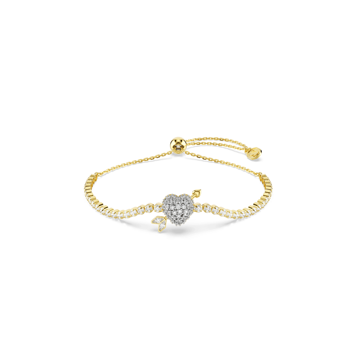 Introducing the Swarovski Idyllia bracelet: an elegant piece featuring a heart with arrow motif crafted from mixed cuts, adorned with sparkling white stones. Accented by delicate leaf-inspired details and finished with a shimmering 18K gold plating, this adjustable bracelet by Swarovski boasts both refinement and modern charm. The sliding bead clasp ensures a perfect fit, making it a beautiful accessory set against any background.