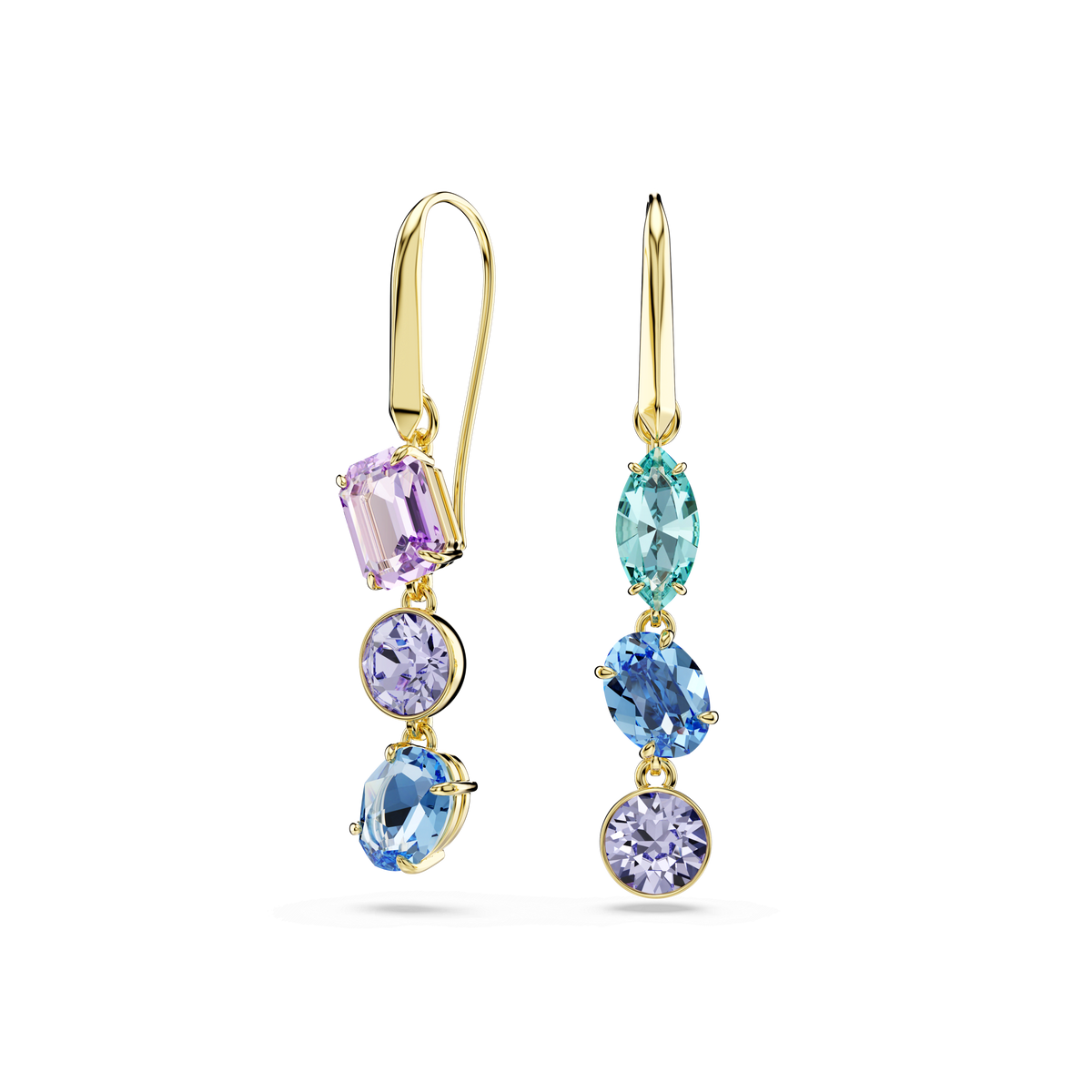 The Swarovski Gema drop earrings showcase an asymmetrical design with mixed-cut, multicolored crystals in pastel purple, teal, light blue, and deep blue, all elegantly set in an 18K gold finish and displayed against a plain white background.